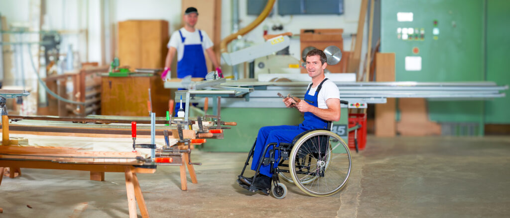 sad young woman sitting on wheelchair in room